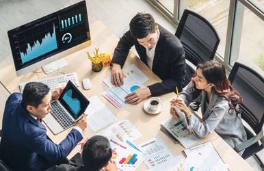 a group of people sitting around a table