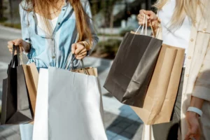 a group of women holding shopping bags