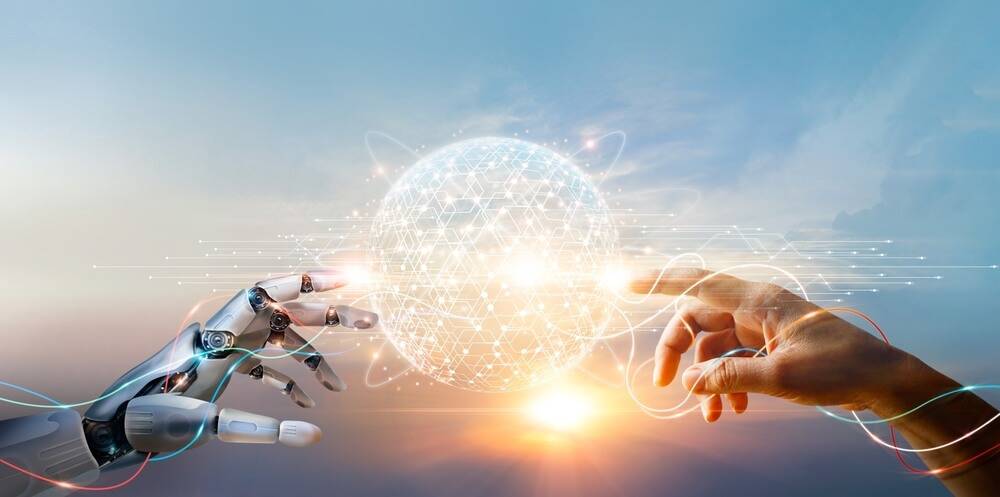 a robot and hand touching a sphere