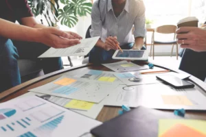 a group of people looking at a tablet