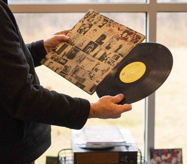 a person holding a record
