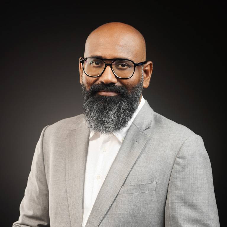 a man with a beard wearing glasses