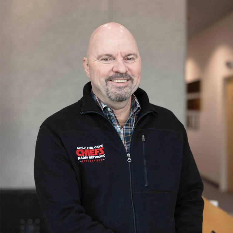 a man smiling at camera