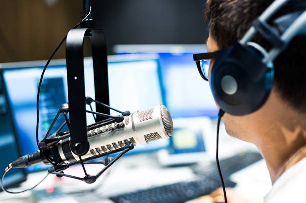 a man wearing headphones and microphone