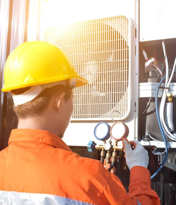 a man wearing a hard hat and gloves
