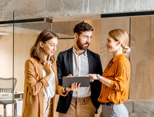 a group of people standing in a room
