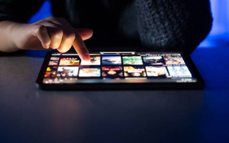 a person touching a tablet